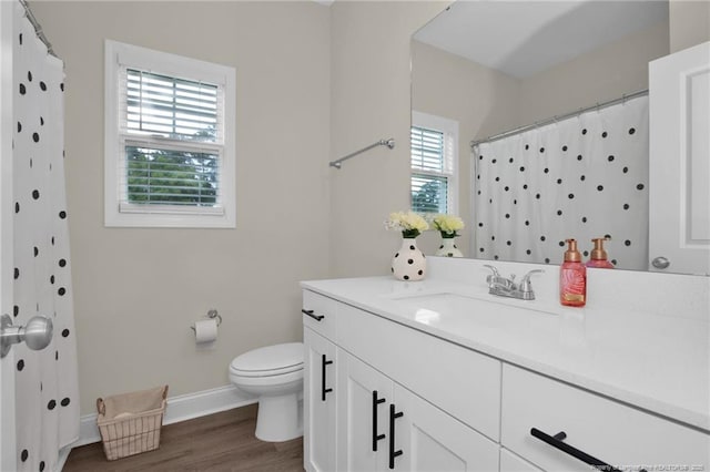 5831 James Allen Ln, Stedman, NC 28391 - bathroom with wood finished floors, toilet, baseboards, vanity, and a shower with curtain