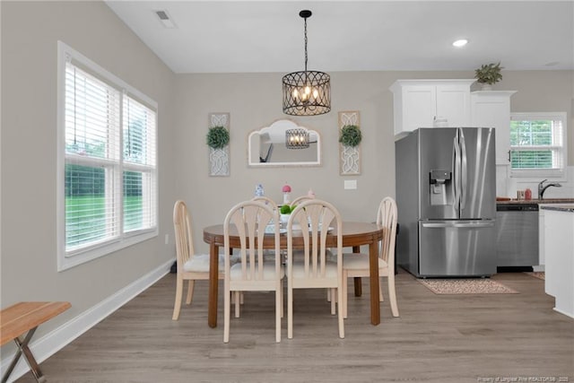 5831 James Allen Ln, Stedman, NC 28391 - dining space featuring a chandelier, light wood-style floors, recessed lighting, and baseboards