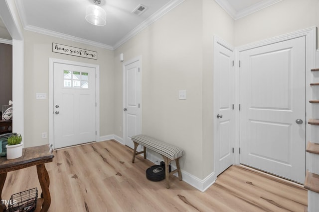 220 Purslane Dr, Franklinton, NC 27525 - entrance foyer with light wood finished floors, crown molding, and baseboards