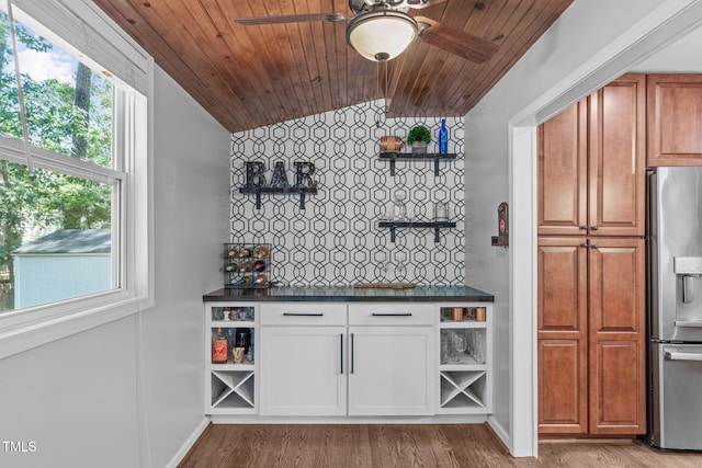 208 Silk Hope Dr, Cary, NC 27519 - indoor bar featuring stainless steel refrigerator with ice dispenser, lofted ceiling, wooden ceiling, light wood finished floors, and a ceiling fan