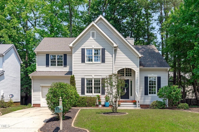 208 Silk Hope Dr, Cary, NC 27519 - traditional-style home with a garage, a front lawn, driveway, a shingled roof, and a chimney