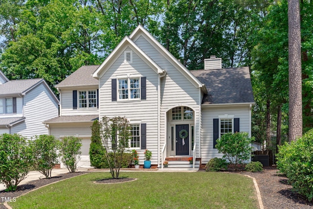 208 Silk Hope Dr, Cary, NC 27519 - traditional-style house with a front lawn, an attached garage, a chimney, and a shingled roof