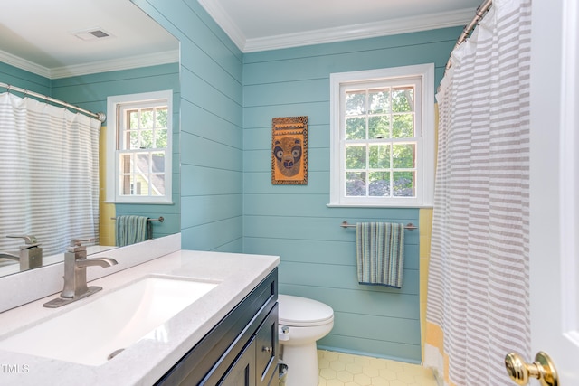 bathroom with ornamental molding, toilet, vanity, and a shower with curtain