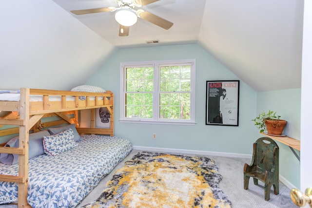 bedroom with carpet, vaulted ceiling, baseboards, and a ceiling fan