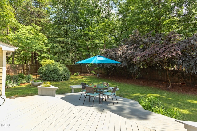 wooden deck featuring outdoor dining space