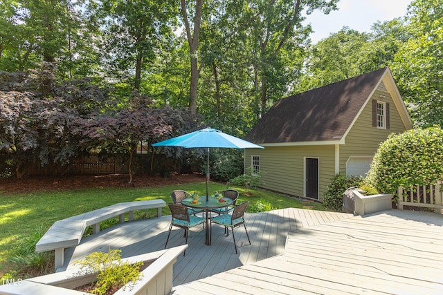 wooden terrace with outdoor dining area