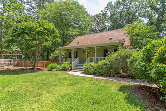 view of front of house featuring board and batten siding, a porch, a chimney, and a shingled roof