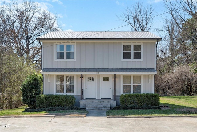 view of front of property featuring board and batten siding and metal roof