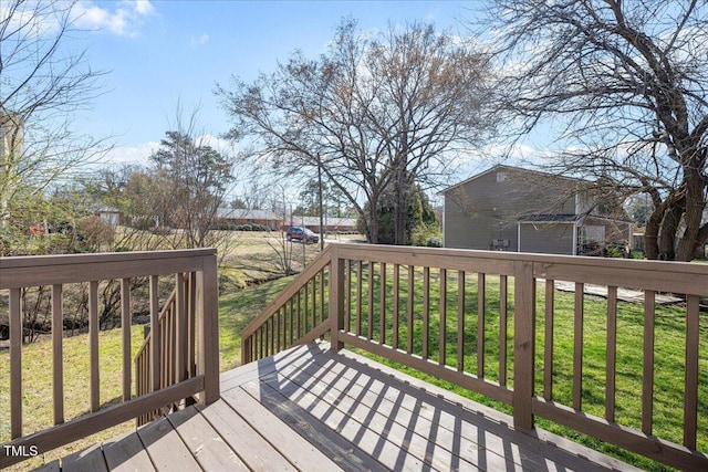 wooden terrace with a yard