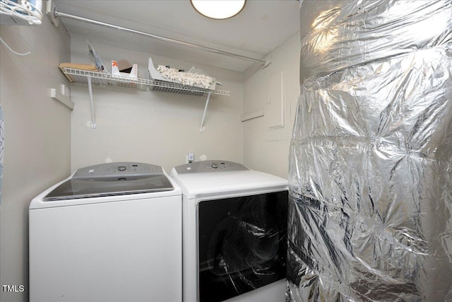 laundry room featuring washing machine and clothes dryer
