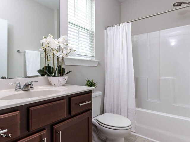 437 Henmore Brook Dr, Cary, NC 27519 - bathroom with toilet, vanity, shower / bath combo, and tile patterned floors