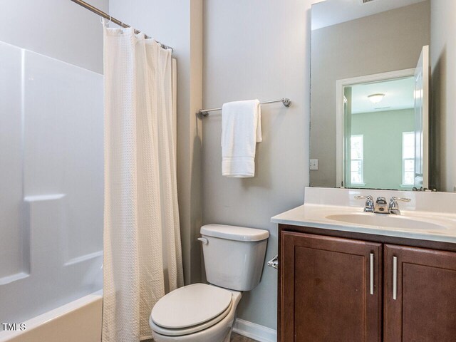 437 Henmore Brook Dr, Cary, NC 27519 - full bathroom with toilet, vanity, and shower / tub combo
