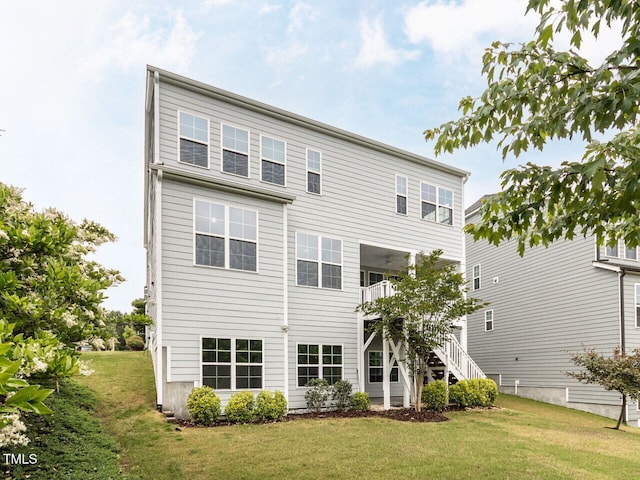 437 Henmore Brook Dr, Cary, NC 27519 - back of property featuring a lawn and stairs