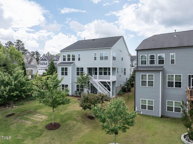 437 Henmore Brook Dr, Cary, NC 27519 - rear view of property with a lawn