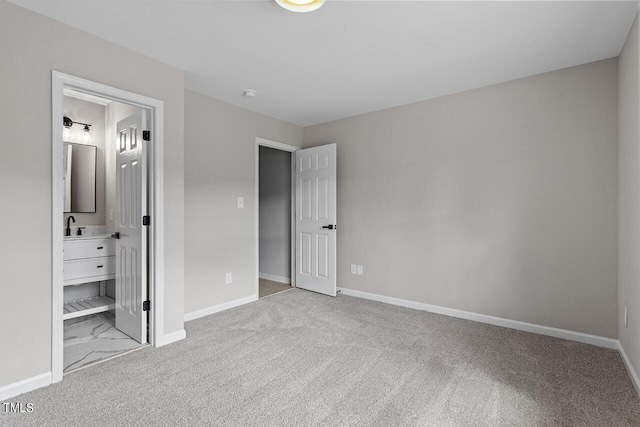 353 E Williams St, Angier, NC 27501 - unfurnished bedroom featuring carpet floors, baseboards, and ensuite bathroom