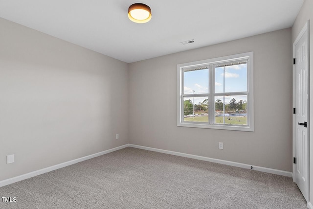 353 E Williams St, Angier, NC 27501 - carpeted spare room featuring baseboards