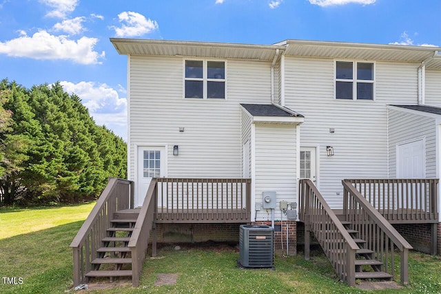 353 E Williams St, Angier, NC 27501 - back of property featuring stairway, a wooden deck, cooling unit, and a lawn