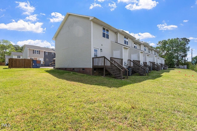 353 E Williams St, Angier, NC 27501 - back of house with crawl space, a lawn, and central AC unit