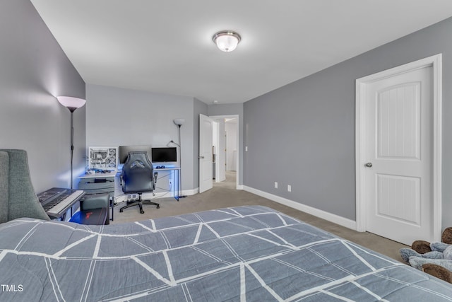 carpeted home office featuring baseboards