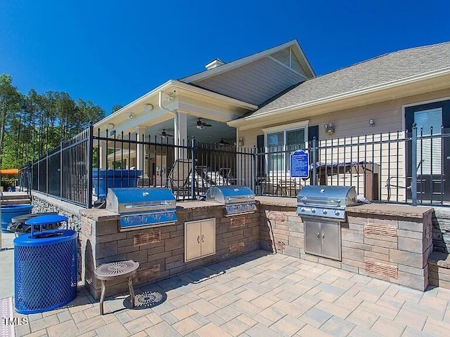 view of patio featuring a grill, area for grilling, and fence