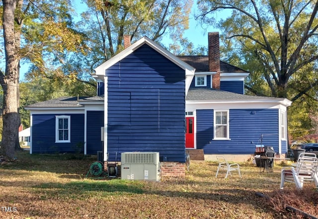 417 S Main St, Warrenton, NC 27589 - rear view of property with a chimney, entry steps, and a lawn