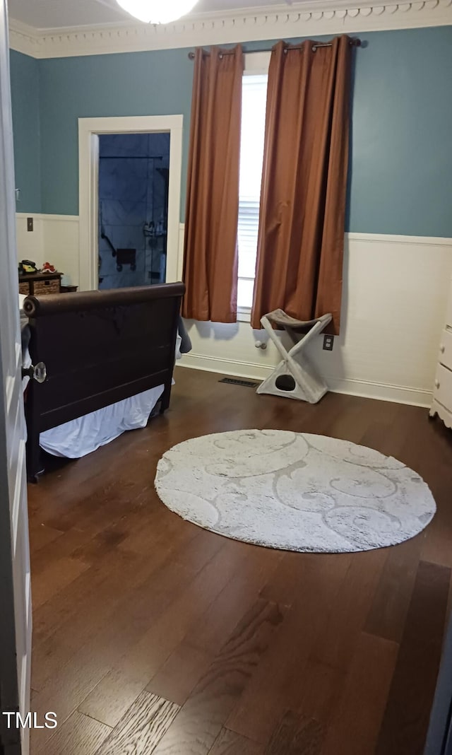 417 S Main St, Warrenton, NC 27589 - bathroom featuring a wainscoted wall, wood finished floors, and plenty of natural light
