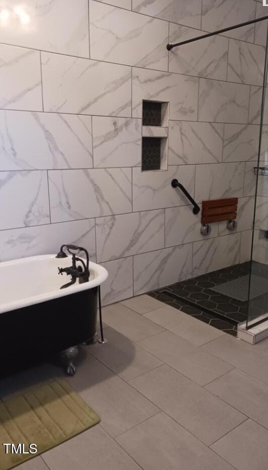 417 S Main St, Warrenton, NC 27589 - full bath featuring a tile shower, tile patterned floors, and a bathtub