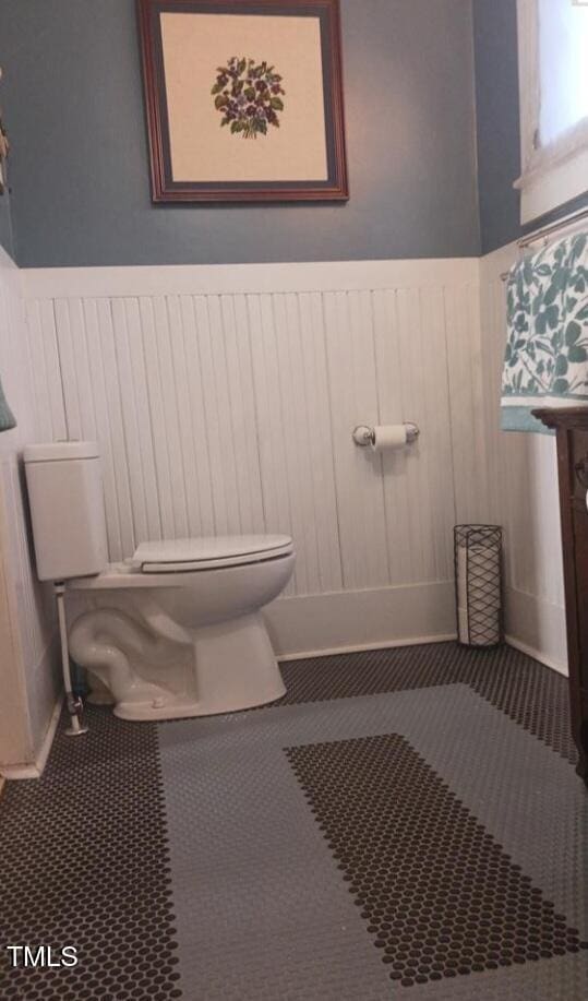 417 S Main St, Warrenton, NC 27589 - bathroom featuring toilet and wainscoting