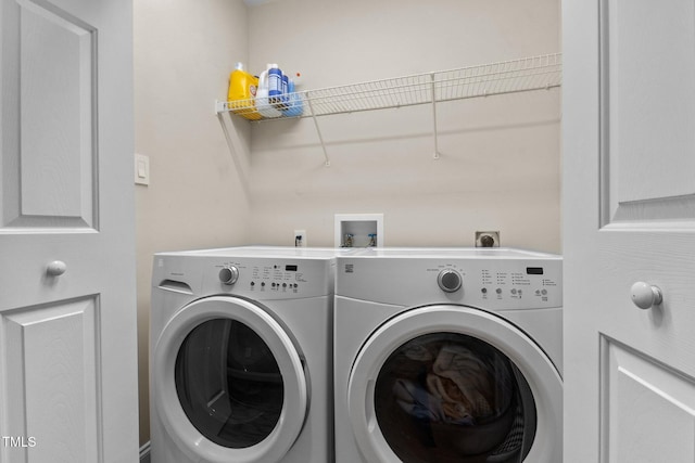 laundry room with washing machine and clothes dryer