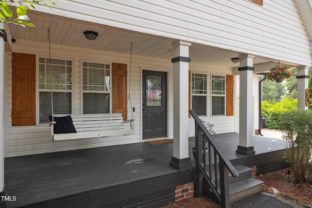 property entrance featuring covered porch