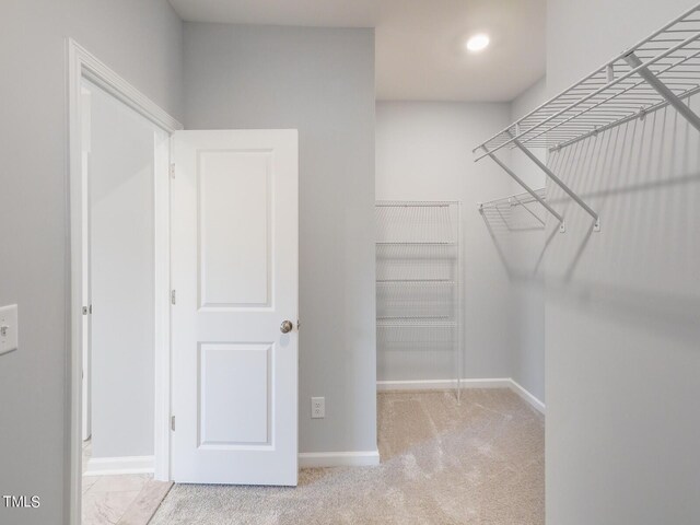 265 Sutherland Dr, Franklinton, NC 27525 - walk in closet with carpet floors