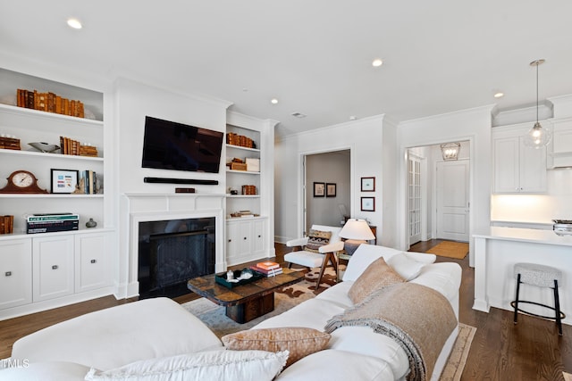 620 Wade Ave Unit 505, Raleigh, NC 27605 - living room with ornamental molding, dark wood-style flooring, a fireplace, and recessed lighting