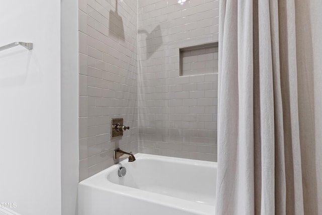 620 Wade Ave Unit 505, Raleigh, NC 27605 - bathroom featuring shower / bath combo with shower curtain
