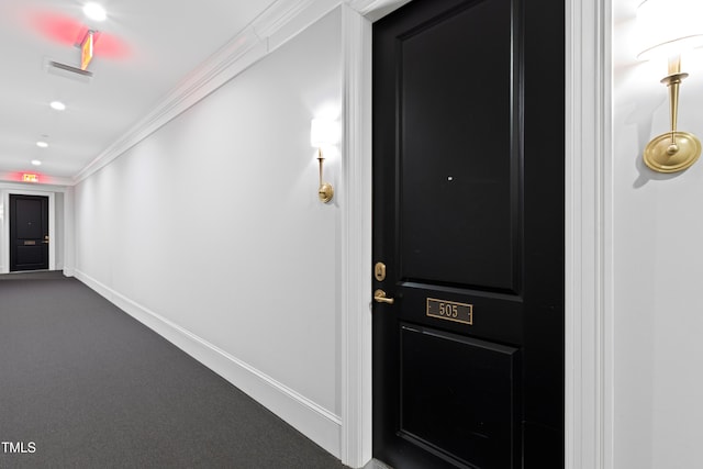 620 Wade Ave Unit 505, Raleigh, NC 27605 - hall featuring dark carpet, crown molding, and baseboards