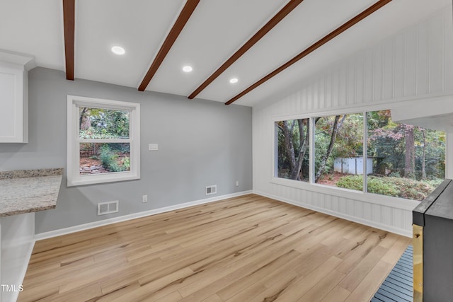 2600 Wade Ave, Raleigh, NC 27607 - unfurnished living room featuring light wood-type flooring, baseboards, and recessed lighting