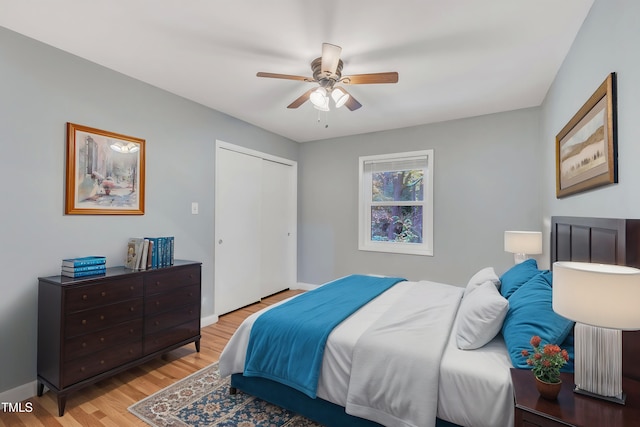 2600 Wade Ave, Raleigh, NC 27607 - bedroom featuring wood finished floors, a closet, ceiling fan, and baseboards
