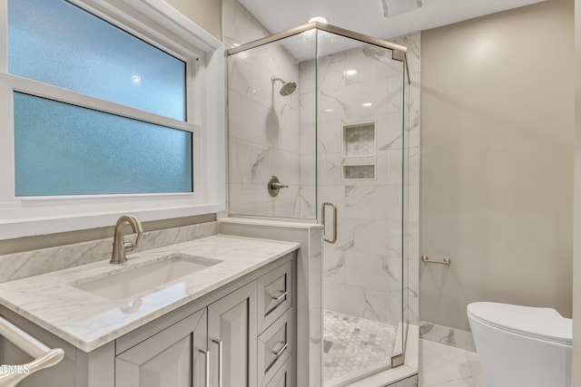 2600 Wade Ave, Raleigh, NC 27607 - full bathroom with marble look tile flooring, a marble finish shower, toilet, and vanity