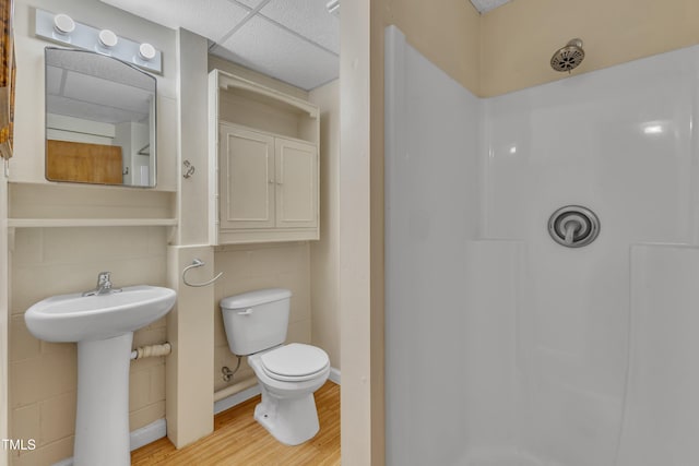 2600 Wade Ave, Raleigh, NC 27607 - bathroom with wood finished floors, a shower, toilet, and a sink