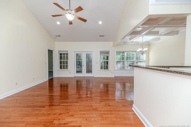 1536 Louisiana Ln, Sanford, NC 27332 - unfurnished living room with a chandelier, a ceiling fan, light wood-style flooring, recessed lighting, and baseboards