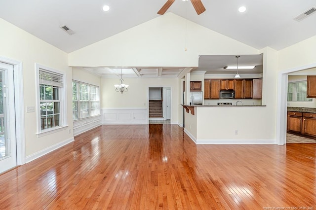 1536 Louisiana Ln, Sanford, NC 27332 - unfurnished living room featuring light wood-style flooring, a chandelier, ceiling fan, wainscoting, and recessed lighting