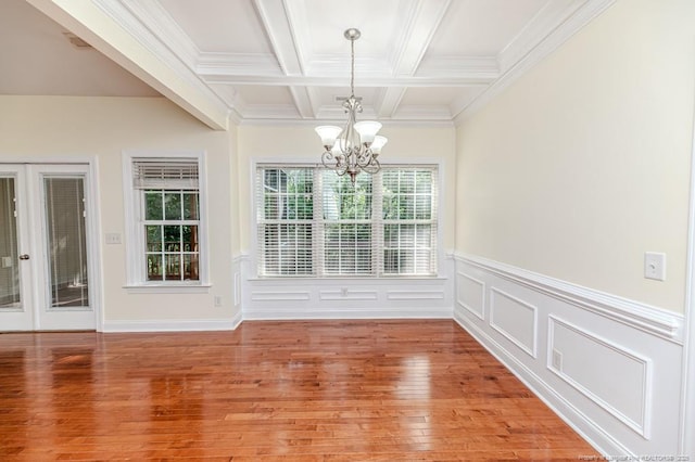 1536 Louisiana Ln, Sanford, NC 27332 - unfurnished dining area featuring a chandelier, light wood-type flooring, beamed ceiling, coffered ceiling, and a wainscoted wall