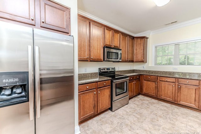 1536 Louisiana Ln, Sanford, NC 27332 - kitchen featuring stainless steel appliances, crown molding, brown cabinetry, and dark stone countertops