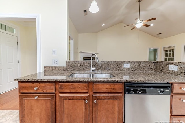 1536 Louisiana Ln, Sanford, NC 27332 - kitchen featuring stainless steel dishwasher, a sink, ceiling fan, light stone counters, and lofted ceiling