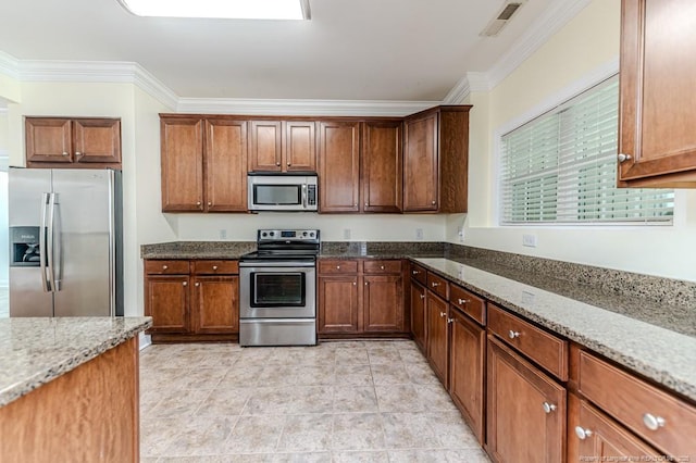 1536 Louisiana Ln, Sanford, NC 27332 - kitchen with stainless steel appliances, crown molding, stone countertops, and brown cabinets