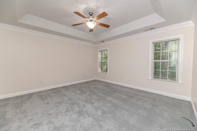 1536 Louisiana Ln, Sanford, NC 27332 - carpeted empty room with a raised ceiling, healthy amount of natural light, ceiling fan, crown molding, and baseboards
