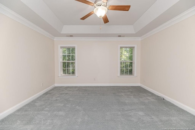 1536 Louisiana Ln, Sanford, NC 27332 - empty room featuring a raised ceiling, carpet floors, ceiling fan, and crown molding