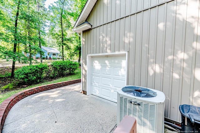 1536 Louisiana Ln, Sanford, NC 27332 - garage featuring concrete driveway and central AC
