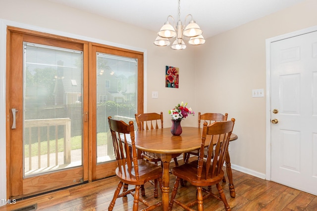 809 Maple Shade Ln, Apex, NC 27502 - dining room with light wood finished floors, plenty of natural light, a chandelier, and baseboards