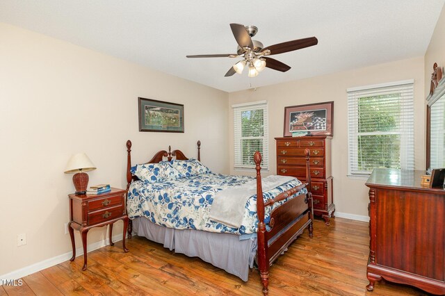 809 Maple Shade Ln, Apex, NC 27502 - bedroom with wood finished floors, baseboards, and ceiling fan