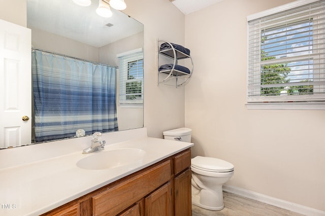 809 Maple Shade Ln, Apex, NC 27502 - full bathroom with healthy amount of natural light, toilet, baseboards, and vanity